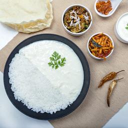 Curd and poriyal rice bowl