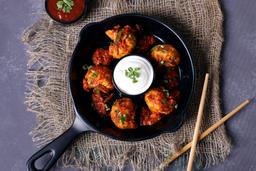 Butter chicken pan tossed momo