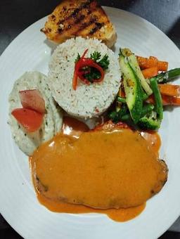 Grilled chicken steak with peri peri sauce