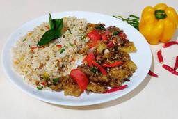 Stir fried crispy fish in chilli basil sauce served with fried rice