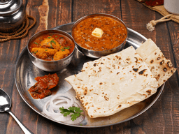 Butter chicken, dal makhani, rumali roti thali