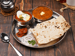 Egg masala, dal makhani, rumali roti thali