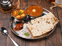Kadhai paneer, dal makhani, rumali roti thali