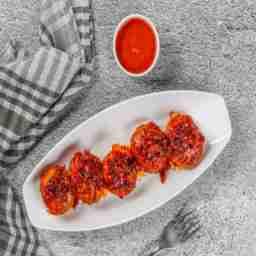Veg sezchwan tossed momo