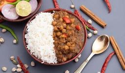 Punjabi chole rice bowl + pickle + salad