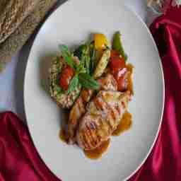 Char grilled chicken in red jus with grilled vegetables