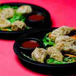 Chicken cheese burst fried momos .