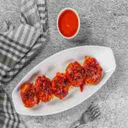 Veg szechuan tossed momos