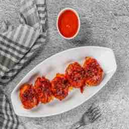 Chicken schezwan tossed momo
