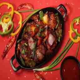 Tossed chilli chicken momo
